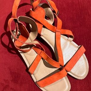 Strappy sandals in orange suede - like new.